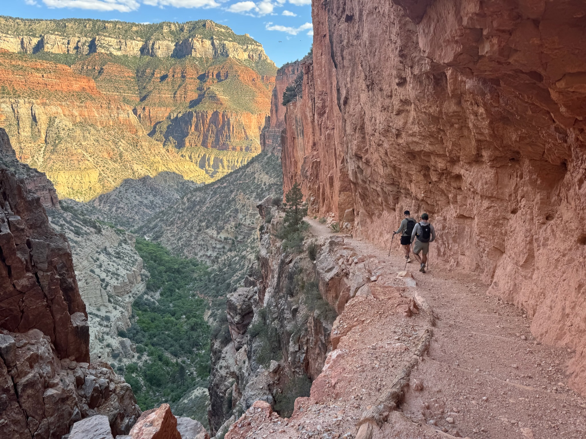 A cabin tucked against the canyon walls.