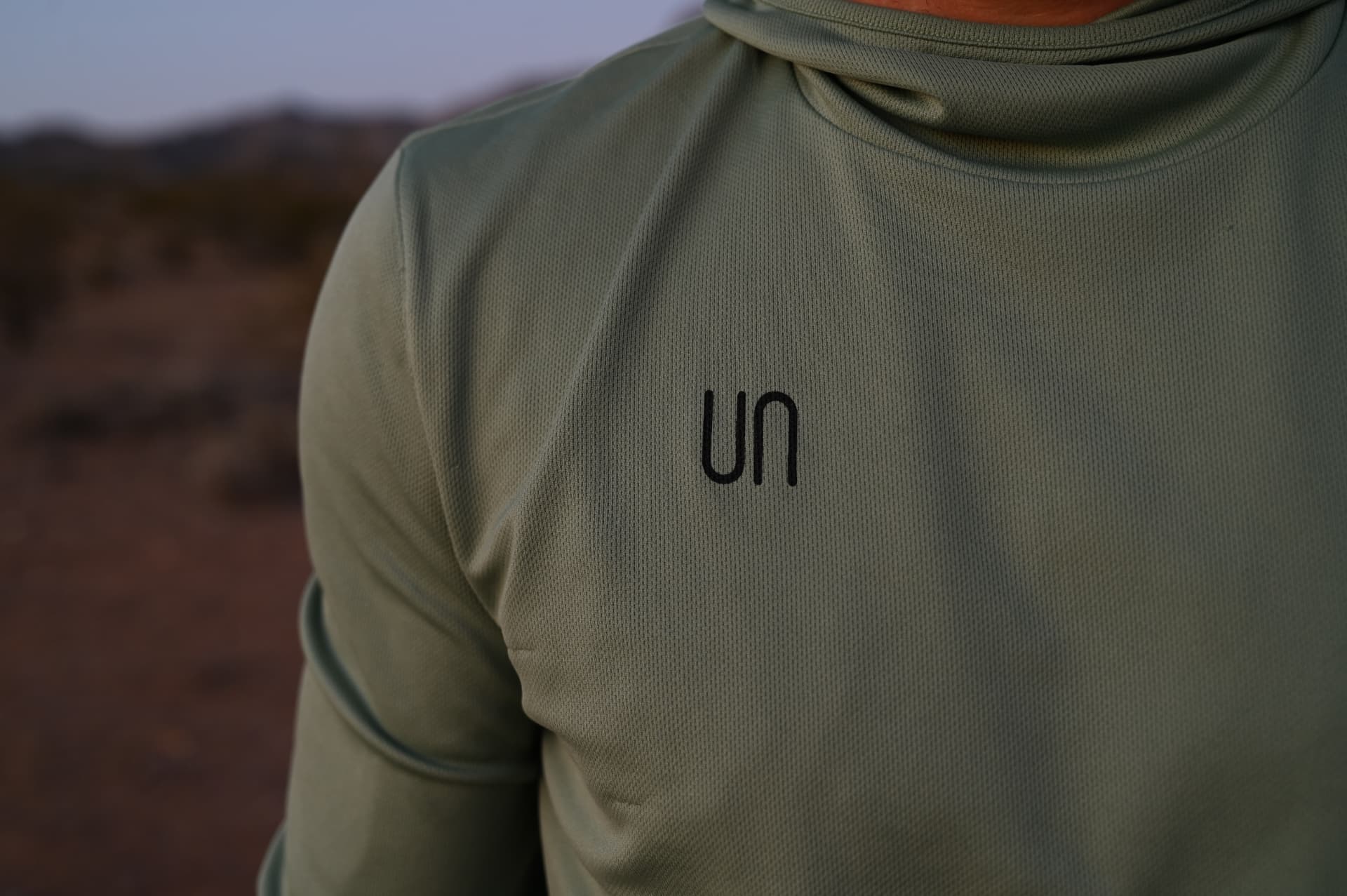 The Unrationed mark on a man's shirt at dusk in the desert