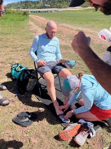 Ring the Springs — crew tending to a runner's feet at the aid station