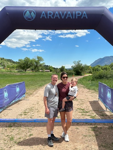 Ring the Springs — finisher with family at the race arch