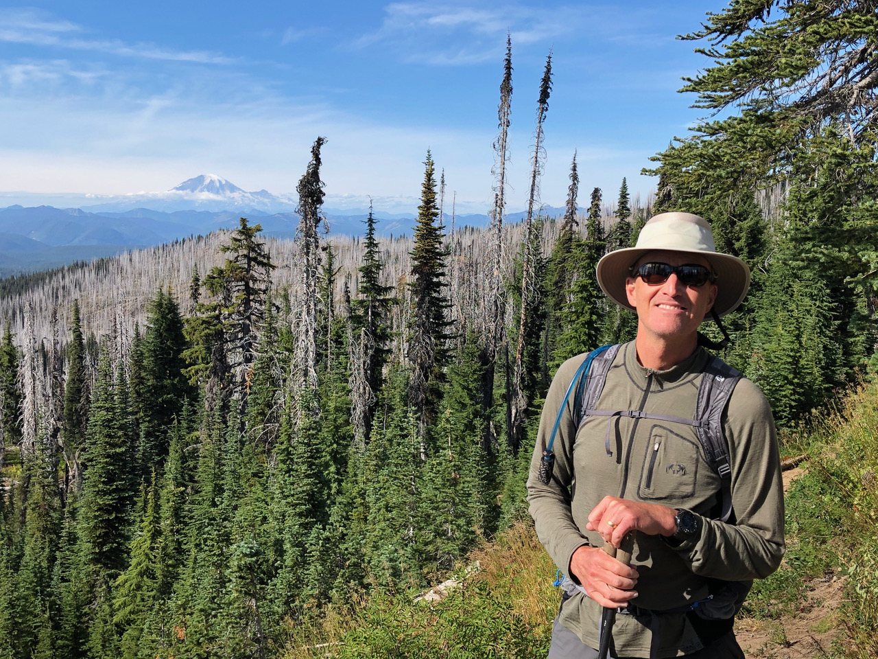 Glen Van Peski on the Pacific Crest Trail in Washington with Mount Adams behind him